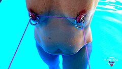 nippleringlover stretches pierced nipples bound in pool