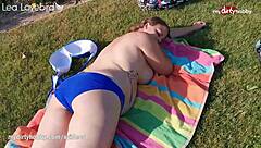 Busty mature redhead fucks dildo on stairs in heels