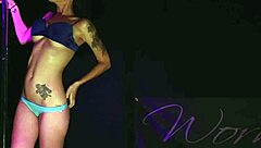 Watch Her Clothes Rip in a Seductive Striptease Dance on Stage
