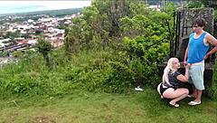 Horny blonde slut sucks African guy's cock on the beach