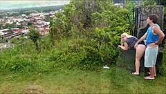 Horny blonde slut sucks African guy's cock on the beach