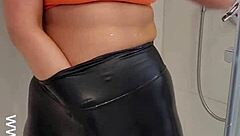 Hey, check out this hot babe in sports bra and leggings getting off in the shower! 😏