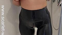 Hey, check out this hot babe in sports bra and leggings getting off in the shower! 😏