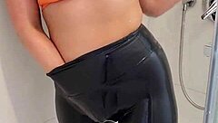 Hey, check out this hot babe in sports bra and leggings getting off in the shower! 😏