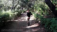 Outdoors, getting naked in Barcelona park.