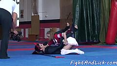 Lesbian babes wrestle in costumes and lick each other's shaved pussies