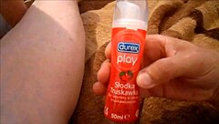 The girl licks the lollipop slowly, savoring the sweet flavor. She twirls it in her mouth with her tongue.