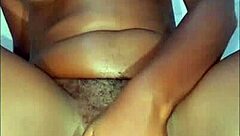 Ebony babe masturbates with wet fingers