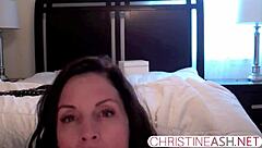 Sexy MILF in hotel bondage outfit uses strapon for webcam masturbation