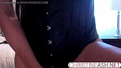 Sexy MILF in hotel bondage outfit uses strapon for webcam masturbation