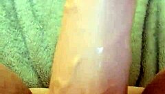 She masturbates with dildo for her man.