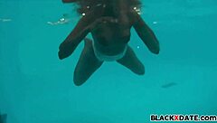 Ebony babe in see-through swimsuit underwater, bikini clinging tight