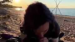 teen gives blowjob on the beach