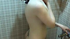 Petite brunette teen Amelie Dubon pleasures herself in the shower