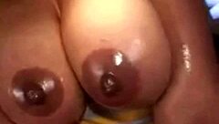 Ebony milf with big oiled boobs strokes cock in pov