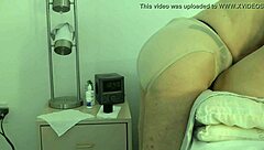 wife takes control, pegging her submissive husband in a domination session at home