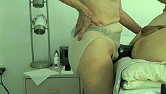 wife takes control, pegging her submissive husband in a domination session at home