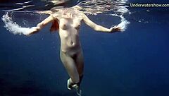 Hot ginger babe swimming underwater in Tenerife bikini scene