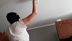 watching my housekeeper clean the chandelier in the garage