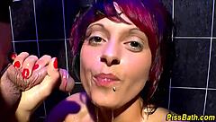 Look at this piss-drenched slut blowing and jerking off the group hard!