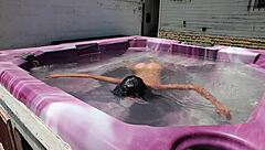 dayanara relaxing in the hot tub