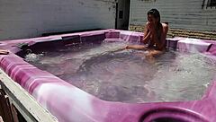 dayanara relaxing in the hot tub