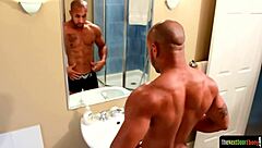 Tattooed black jock strokes swollen dong in gay fetish scene