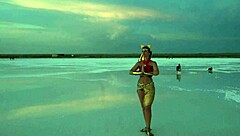 Mature amateurs dancing under pink sky