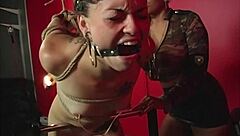 Maxine X spanks Kaera Cruz's big ass in bondage