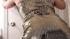 This hot crossdresser rocks a sexy gold dress while taking a monster cock in panties and stockings!