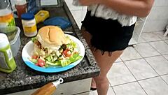 Sarah Rosa intensely cooks sexy hamburger in kitchen