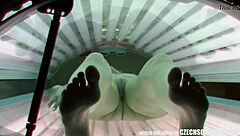 i spied on this amazing pierced babe getting nude in the solarium, wow