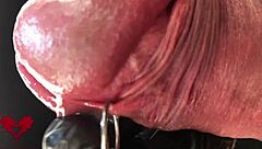 close-up extreme view of latex gloves detailing peehole and cumshot