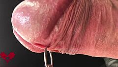 close-up extreme view of latex gloves detailing peehole and cumshot