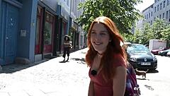 A cute babe enjoys playing outdoors in the public park.