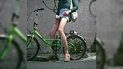 Shemale masturbates on street