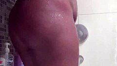 Ebony woman in shower close up