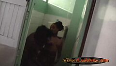 I watch two horny ebony lesbians kiss in the shower.