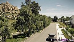 Beautiful lesbians with glasses kiss passionately.