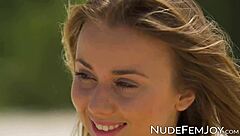 Look at this pretty babe teasing her perfect little pussy at the beach.