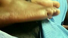 wife gives footjob to husband at home