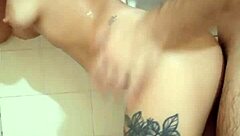 Petite 18+ amateur gives blowjob and engages in hard sex in the shower, moaning loudly.
