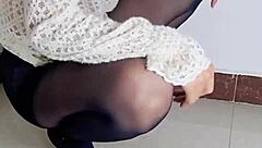 Is this brunette getting wet while preparing for work?