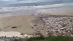 a skinny brazilian with tattoos gives a beautiful blowjob by the sea