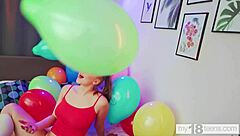 My18teen girl with big tits plays nude with balloons