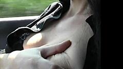 An exhibitionist shows off her big natural tits in the park