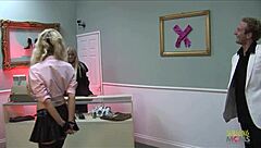 Two blonde girls chat during a casual threesome in the shoe store