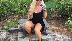 Kelley Cabbana indulges in public pussy play in the park, masturbating outdoors under the open sky.