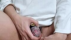 korslaveman - locked in chastity belt playing with urethra toys.