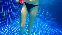 Girl fucks black dildo in public pool